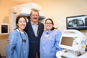 University of Maryland Dental School student Jimin Kim with Monocacy Health Partners Oral and Maxillofacial Surgeon Dr. Vincent DeFabio and MHP Dental Clinic Assistant Sophie Paulsgrove.